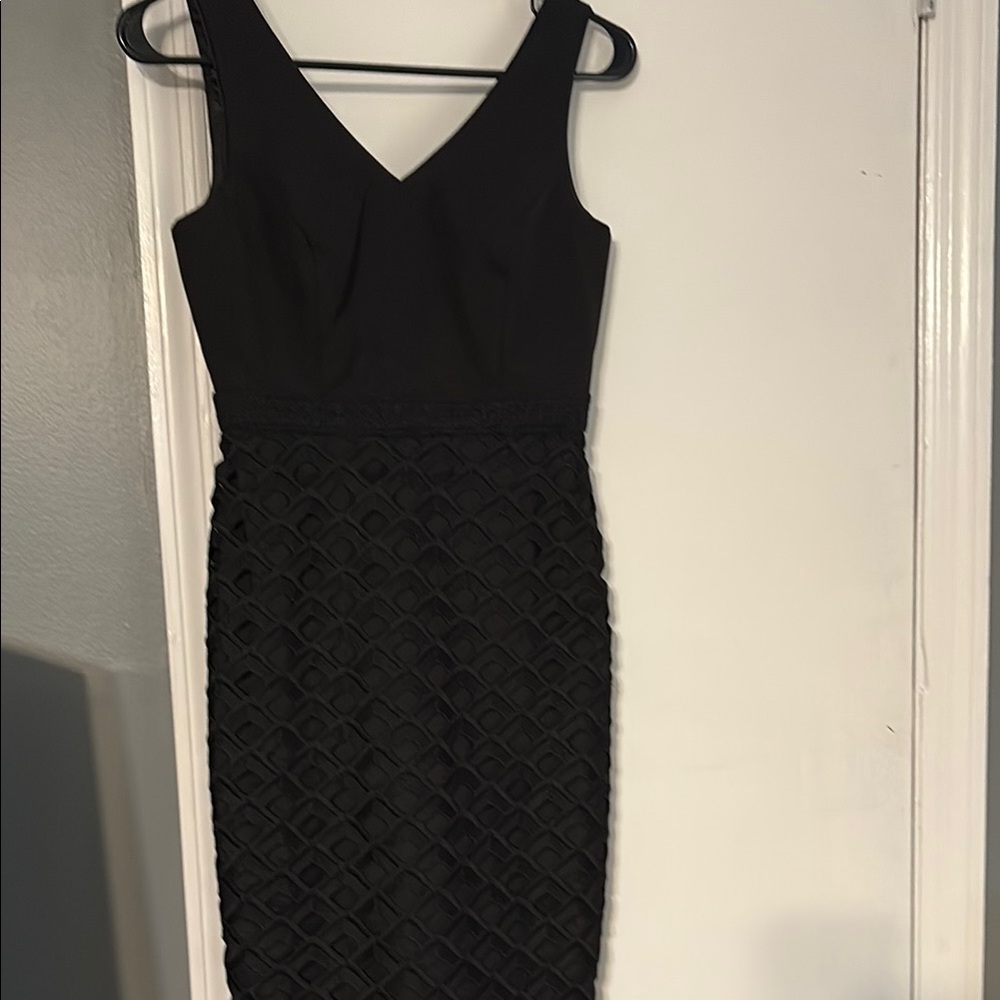 NWT. White House Black Market. Size 0p. Beautiful v neck black dress
